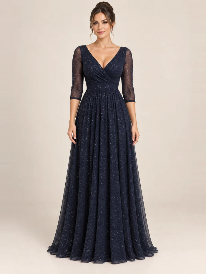 Vestido de grado y fiesta tul brillante con manga transparente en color azul marino, nuevo ingreso de la colección 2026 de Casa París en modelo virtual