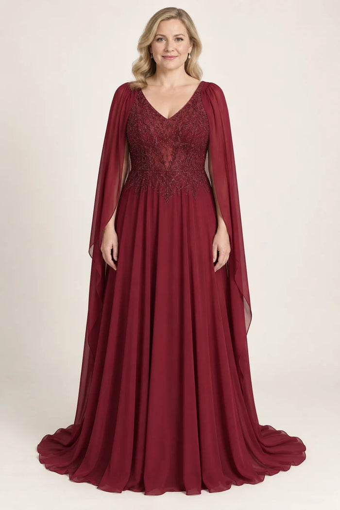 Vestido de grado capa y falda fluida en color vino, colección 2026 de Casa París en modelo virtual