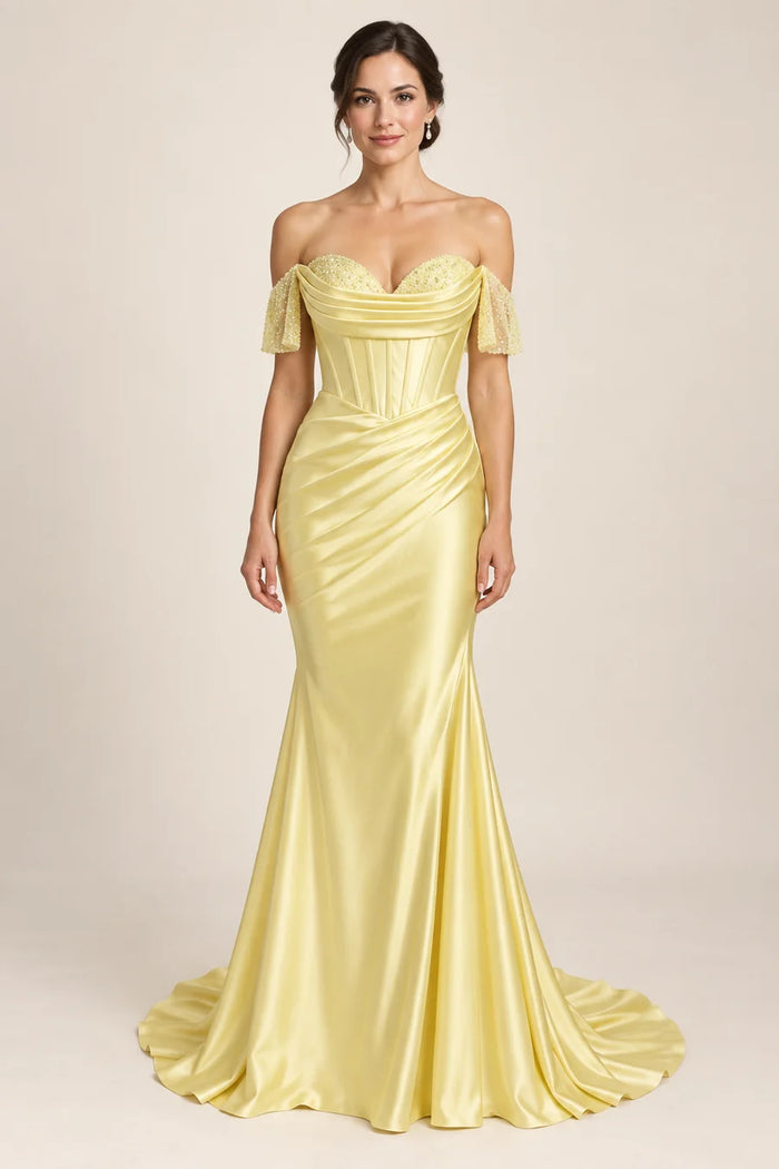 Vestido de grado hombros descubiertos y drapeado en color amarillo, colección 2026 de Casa París en modelo virtual