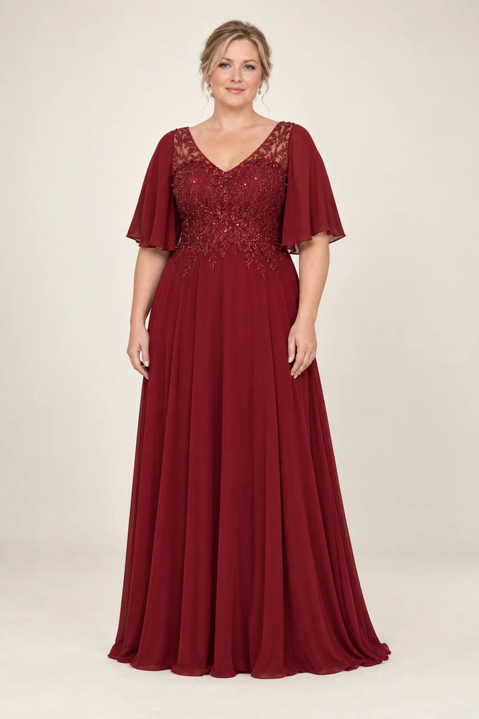 Vestido de grado mangas amplias y bordado en color vino, colección 2026 de Casa París en modelo virtual